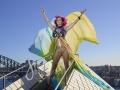 Courtney Act on top of the largest sail of the Opera House - for SGLMG and Destination NSW