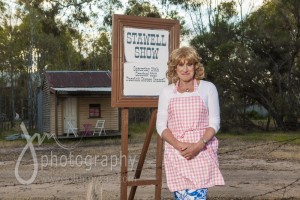 An advertisement for the Stawell Show was erected beside the road, in front of Denise's little house