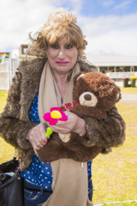 Denise proudly displaying the 2 prizes she won at side show alley