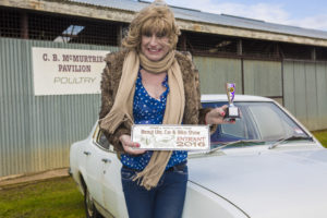 Here's Denise at the car, displaying her trophies...oh, there you go...she also got a trophey...not bad!